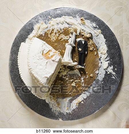 Stock Image - Wedding cake visual metaphor with figurine cake toppers. Fotosearch