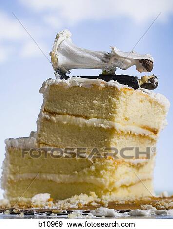 Wedding cake visual metaphor with figurine cake toppers View Large Photo Image Stock Photo - Wedding cake visual metaphor with figurine cake toppers. Fotosearch