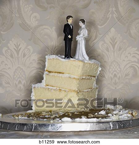 Wedding cake visual metaphor with figurine cake toppers View Large Photo Image Stock Photo - Wedding cake visual metaphor with figurine cake toppers. Fotosearch