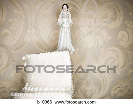 Wedding cake visual metaphor with figurine cake toppers View Large Photo Image Stock Photograph - Wedding cake visual metaphor with figurine cake toppers. Fotosearch