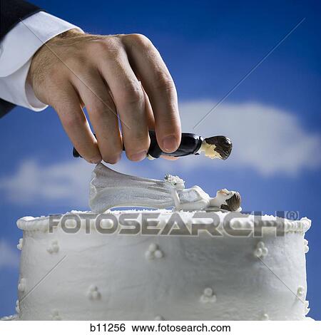 Wedding cake visual metaphor with figurine cake toppers View Large Photo Image Stock Photograph - Wedding cake visual metaphor with figurine cake toppers. Fotosearch