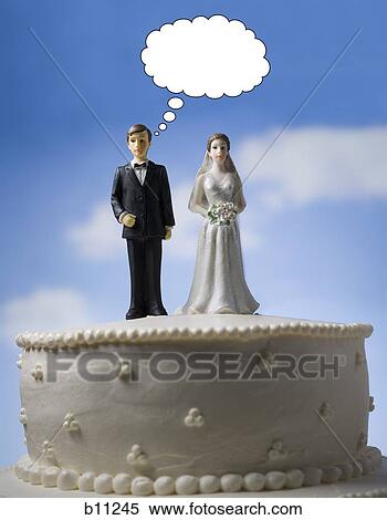 Wedding cake visual metaphor with figurine cake toppers View Large Photo Image Stock Photography - Wedding cake visual metaphor with figurine cake toppers. Fotosearch