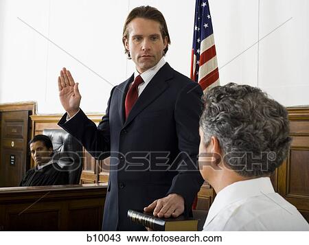 Witness swearing over the Bible View Large Photo Image Stock Image - Witness swearing over the Bible. Fotosearch