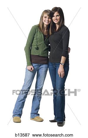 Woman and girl embracing View Large Photo Image Stock Photo - Woman and girl embracing. Fotosearch