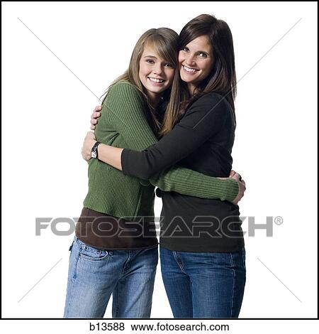 Woman and girl embracing View Large Photo Image Stock Photo - Woman and girl embracing. Fotosearch
