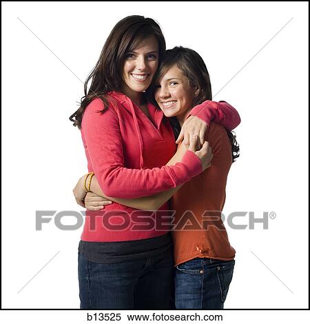 Woman and girl embracing View Large Photo Image Stock Photography - Woman and girl embracing. Fotosearch