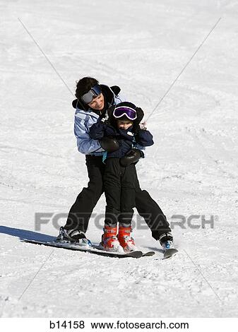 Woman and young girl skiing View Large Photo Image Stock Photo - Woman and young girl skiing. Fotosearch