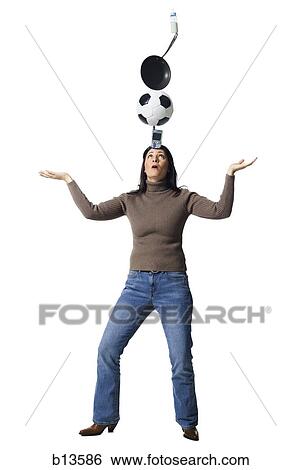 Woman balancing items on her head View Large Photo Image Stock Photograph - Woman balancing items on her head. Fotosearch