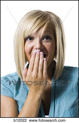 Woman covering mouth View Large Photo Image Stock Image - Woman covering mouth. Fotosearch