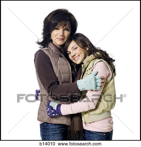 Woman embracing teenage girl View Large Photo Image Stock Image - Woman embracing teenage girl. Fotosearch