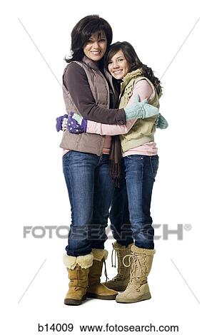 Stock Photo - Woman embracing teenage girl. Fotosearch
