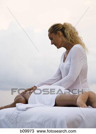 Woman getting a massage from a message therapist, Costa Rica View Large Photo Image Stock Image - Woman getting a massage from a message therapist, Costa Rica. Fotosearch
