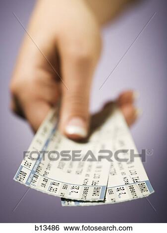Stock Photograph - Woman giving tickets. Fotosearch