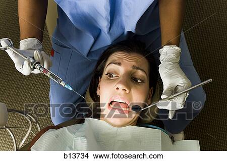 Picture - Woman having dental examination. Fotosearch