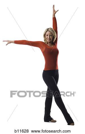 Woman holding a dance pose View Large Photo Image Stock Photo - Woman holding a dance pose. Fotosearch