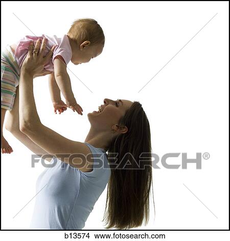 Picture - Woman holding baby girl. Fotosearch