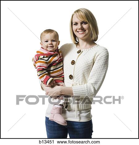 Woman holding baby girl View Large Photo Image Stock Image - Woman holding baby girl. Fotosearch