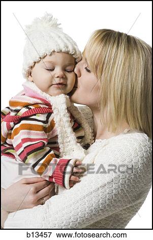 Stock Photo - Woman holding baby girl. Fotosearch