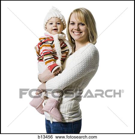 Woman holding baby girl View Large Photo Image Stock Photograph - Woman holding baby girl. Fotosearch