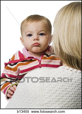 Woman holding baby girl View Large Photo Image Stock Photography - Woman holding baby girl. Fotosearch