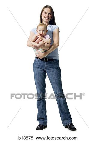 Stock Photography - Woman holding baby girl. Fotosearch