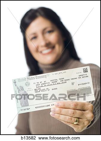 Stock Image - Woman holding cheque from US Treasury Prototype. Fotosearch