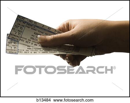 Woman holding concert tickets View Large Photo Image Picture - Woman holding concert tickets. Fotosearch