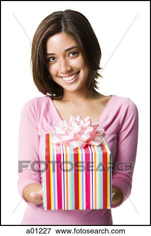 Woman holding gift box View Large Photo Image Stock Photo - Woman holding gift box. Fotosearch