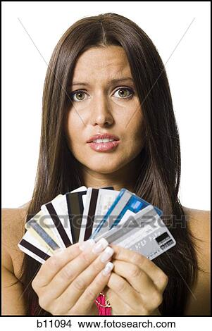 Woman holding several credit cards View Large Photo Image Picture - Woman holding several credit cards. Fotosearch