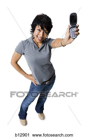 Stock Image - Woman holding up a cell phone. Fotosearch