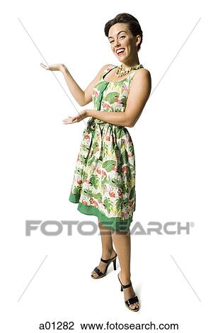 Woman in floral dress gesturing View Large Photo Image Stock Image - Woman in floral dress gesturing. Fotosearch