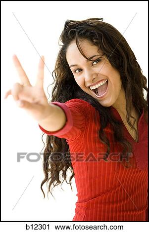 Woman in red shirt making peace gesture View Large Photo Image Stock Image - Woman in red shirt making peace gesture. Fotosearch