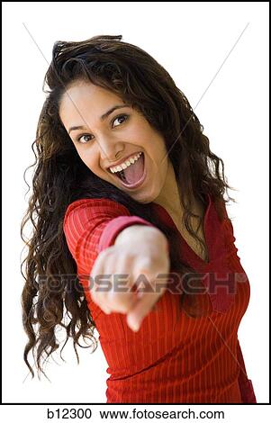 Woman in red shirt pointing View Large Photo Image Stock Image - Woman in red shirt pointing. Fotosearch