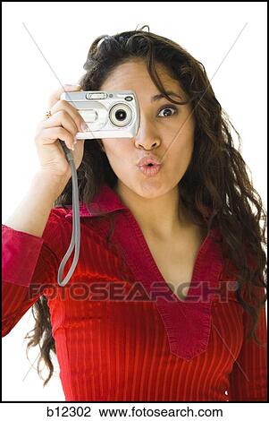 Woman in red shirt taking picture with digital camera View Large Photo Image Stock Image - Woman in red shirt taking picture with digital camera. Fotosearch
