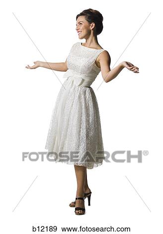 Woman in white dress gesturing View Large Photo Image Stock Photo - Woman in white dress gesturing. Fotosearch