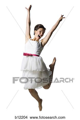 Picture - Woman in white dress jumping. Fotosearch