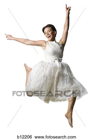 Woman in white dress jumping View Large Photo Image Stock Photograph - Woman in white dress jumping. Fotosearch