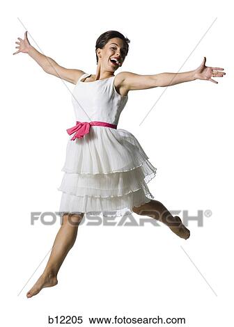 Woman in white dress jumping View Large Photo Image Stock Photography - Woman in white dress jumping. Fotosearch