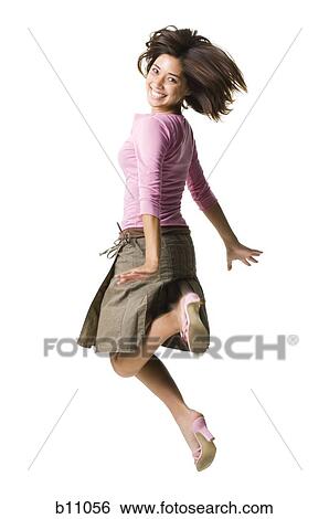 Stock Photograph - Woman jumping. Fotosearch