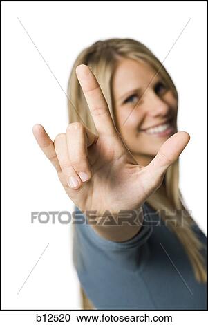 Woman making the i love you" sign" View Large Photo Image Stock Image - Woman making the i love you" sign". Fotosearch