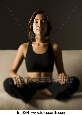 Picture - Woman meditating. Fotosearch