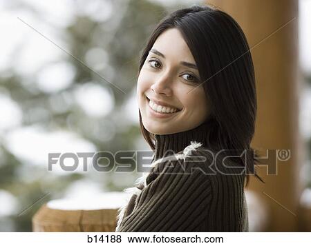 Stock Photo - Woman outdoors in winter smiling. Fotosearch
