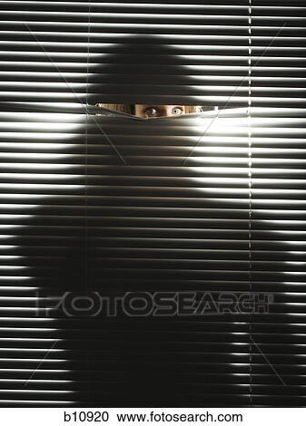 Woman peeping through horizontal blinds View Large Photo Image Stock Image - Woman peeping through horizontal blinds. Fotosearch