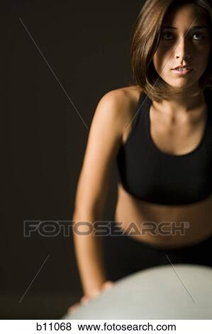 Woman performing Pilates exercises View Large Photo Image Stock Photo - Woman performing Pilates exercises. Fotosearch