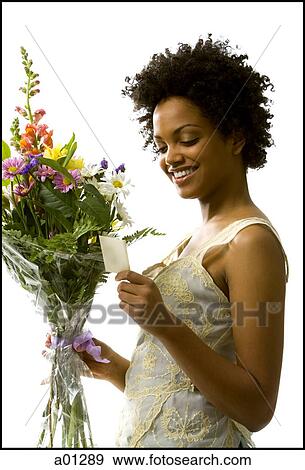 Woman receiving bouquet of flowers View Large Photo Image Stock Photo - Woman receiving bouquet of flowers. Fotosearch