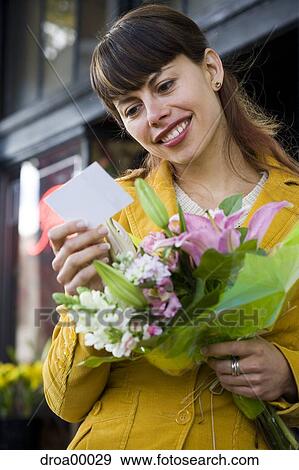 Stock Photo - Woman receiving bouquet of flowers. Fotosearch