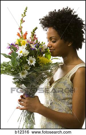 Stock Photograph - Woman receiving bouquet of flowers. Fotosearch