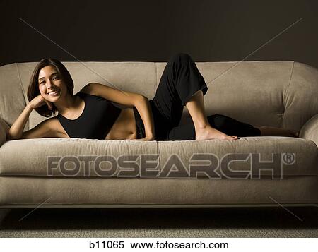 Stock Photography - Woman relaxing during workout. Fotosearch