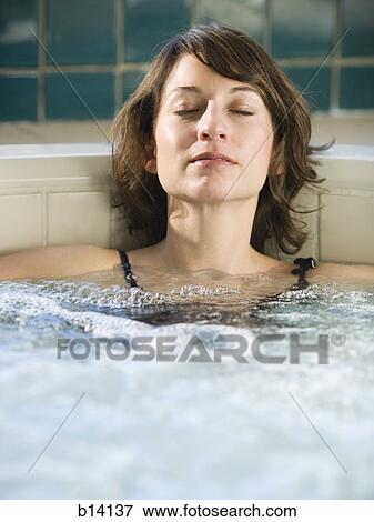 Stock Photo - Woman relaxing in whirlpool. Fotosearch