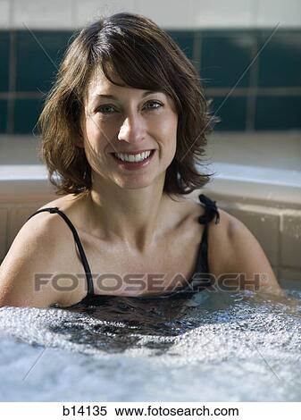 Woman relaxing in whirlpool View Large Photo Image Stock Photography - Woman relaxing in whirlpool. Fotosearch